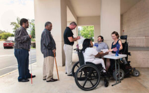People in line to vote, some with canes and wheelchairs